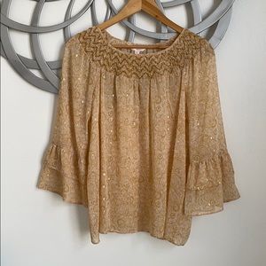 Smocked, pullover blouse.